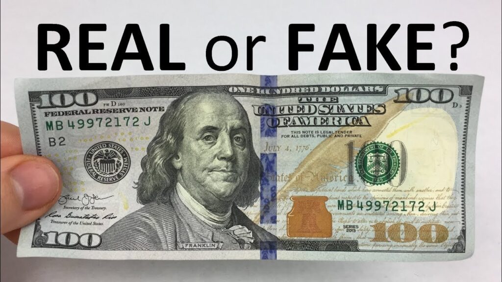 how to tell if a 100 dollar bill is fake